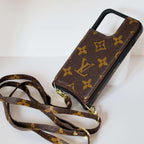 LV monogram leather iPhone case close-up highlighting the material finish and protective corners