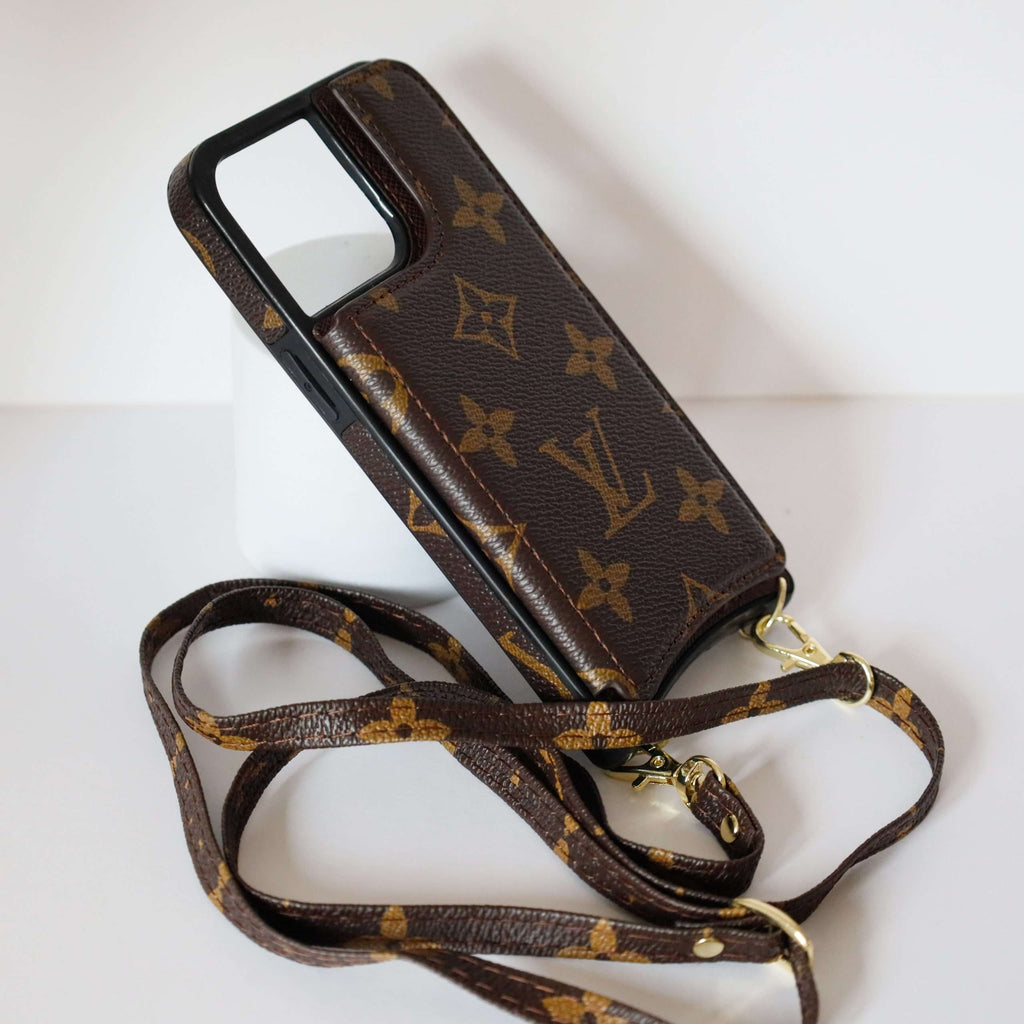 LV monogram leather iPhone case showing the fitted protective edges and camera area
