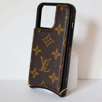 LV monogram leather iPhone case showing the patterned rear cover and protective camera opening