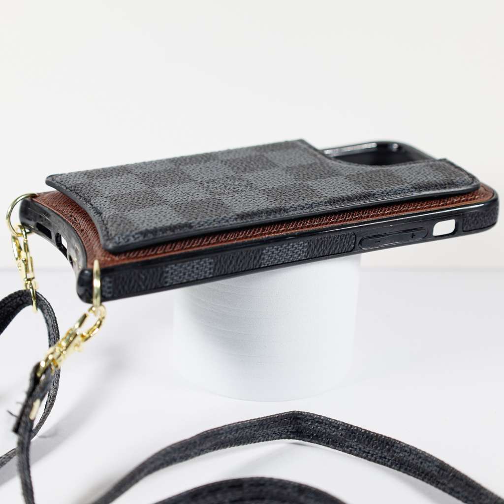 Black checkered leather iPhone wallet case showing the slim folding profile and protective edges