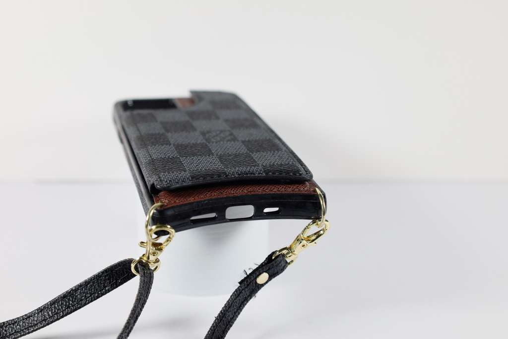 Black checkered leather iPhone wallet case showing the patterned rear cover and fitted corners