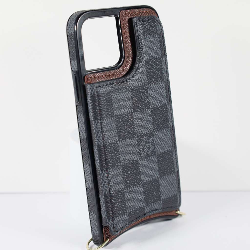 Black checkered leather iPhone wallet case close-up showing the patterned leather texture