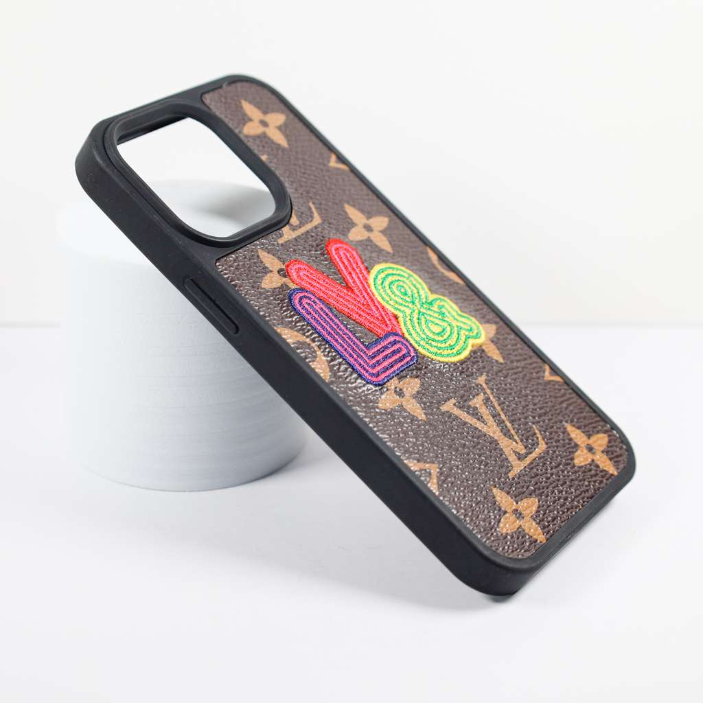 Close-up of the fashion leather iPhone case highlighting the embroidery and material