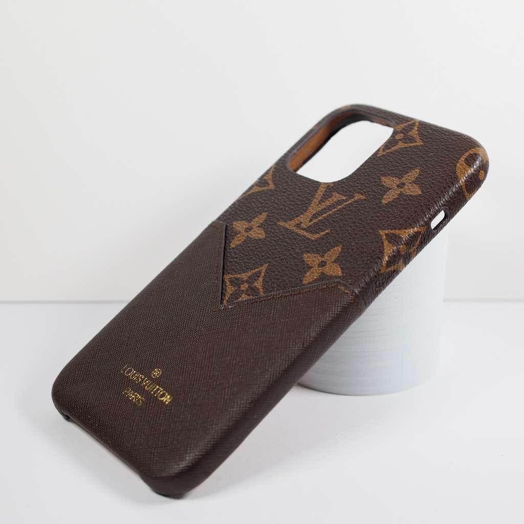 Brown leather iPhone case with card holder showing the slim wallet-style profile