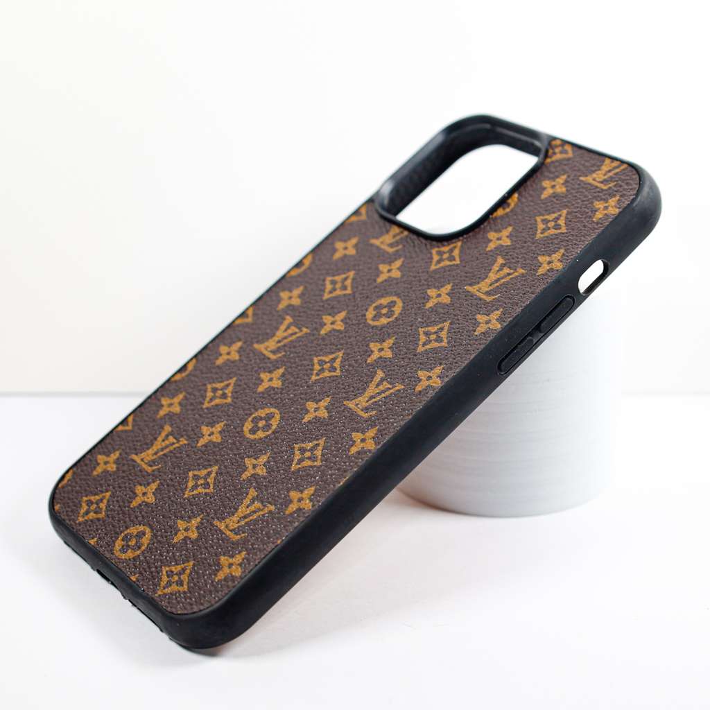 Close-up of the brown monogram iPhone case highlighting the leather texture and pattern