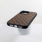Detailed view of the brown monogram leather iPhone case and its patterned surface
