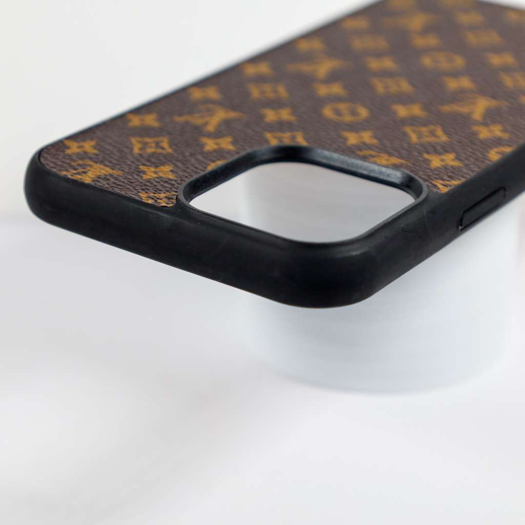 Brown monogram iPhone case showing the leather back, camera cutout and overall fit