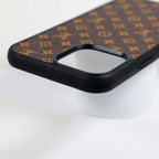 Brown monogram iPhone case showing the leather back, camera cutout and overall fit