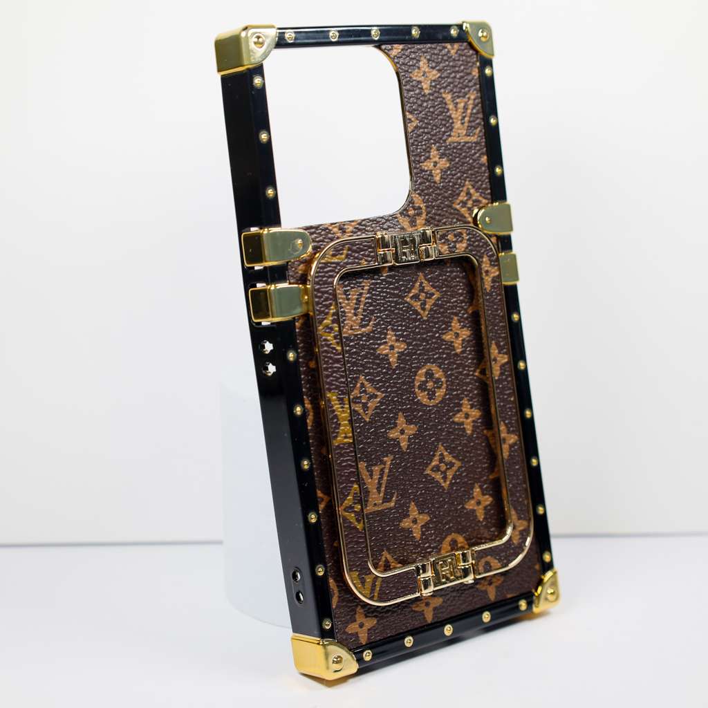 Luxury trunk iPhone case showing the structured rear cover and foldable kickstand detail