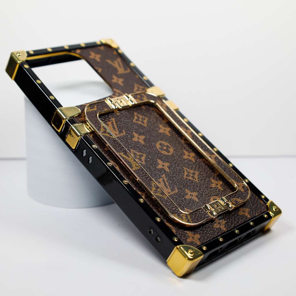 Luxury trunk iPhone case showing the fitted camera opening and reinforced protective edges