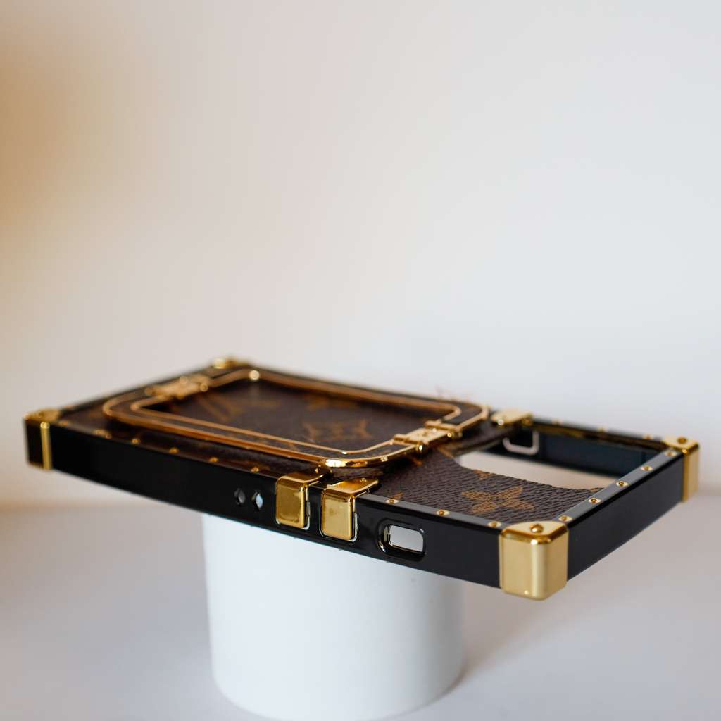 Louis Vuitton trunk iPhone case showing the complete trunk-style protective cover and finish