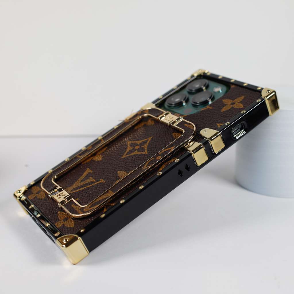 Louis Vuitton trunk iPhone case showing the fitted camera opening and protective corners
