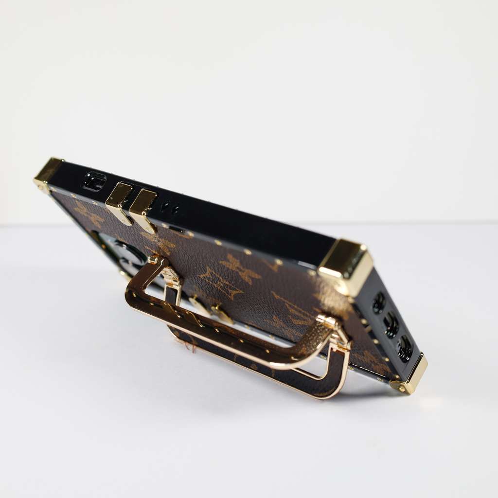 Louis Vuitton trunk iPhone case showing the patterned rear design and fitted edges