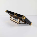 Luxury trunk iPhone case close-up showing the complete kickstand design and protective finish