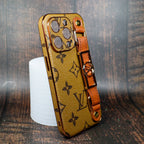 Close-up of the latte folding iPhone case showing leather texture and strap attachment
