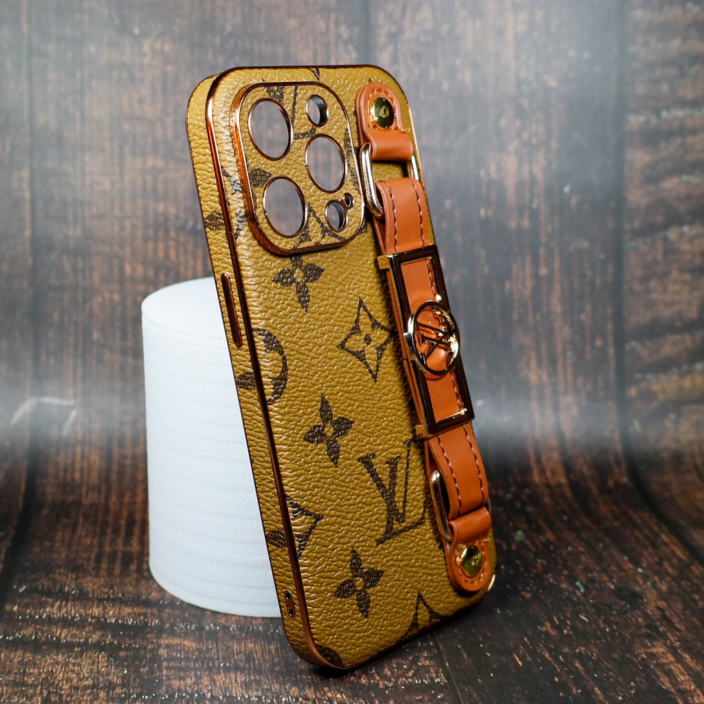 Close-up of the latte folding iPhone case showing leather texture and strap attachment