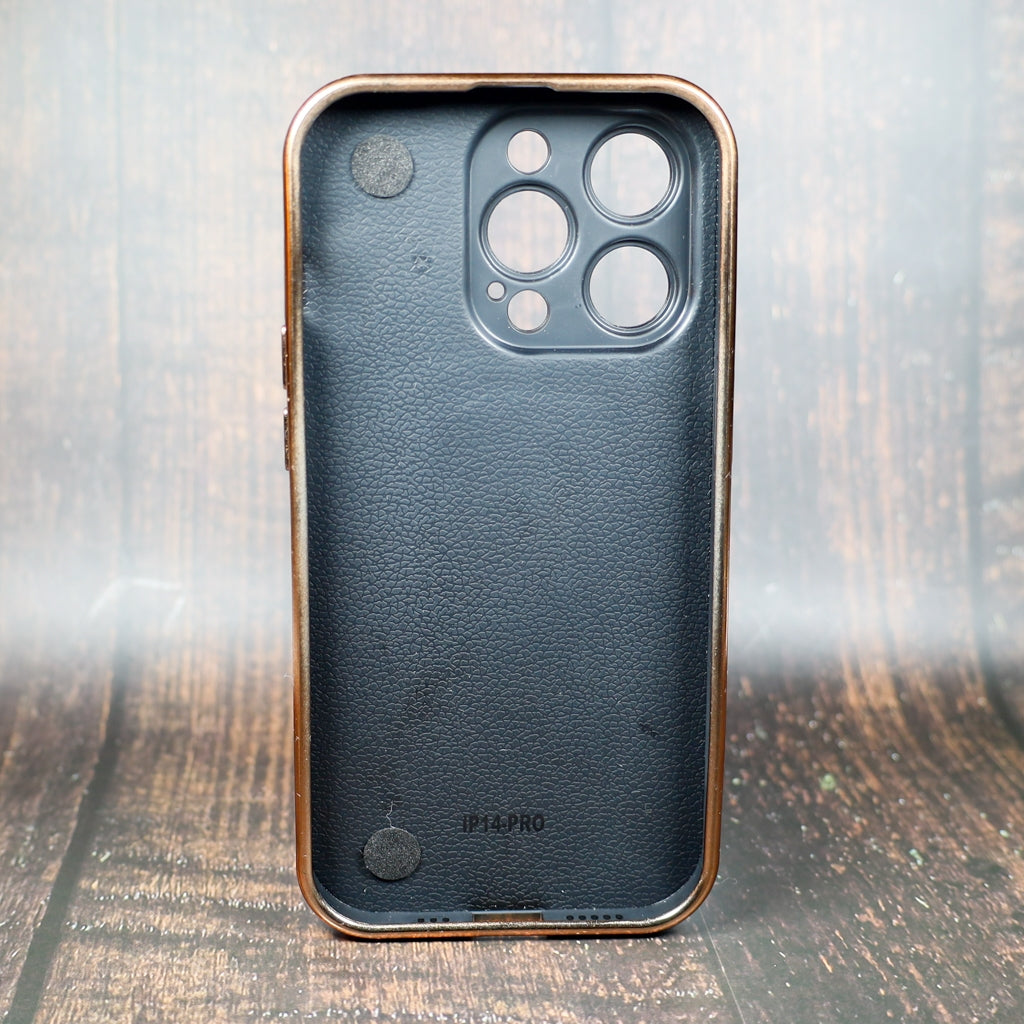 Close-up of the latte LV folding iPhone case showing the patterned cover and strap