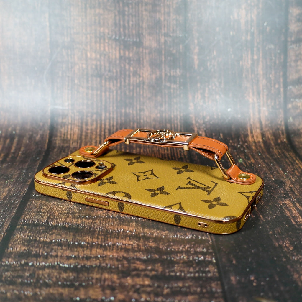 Detailed view of the LV folding phone case showing the strap and patterned leather finish