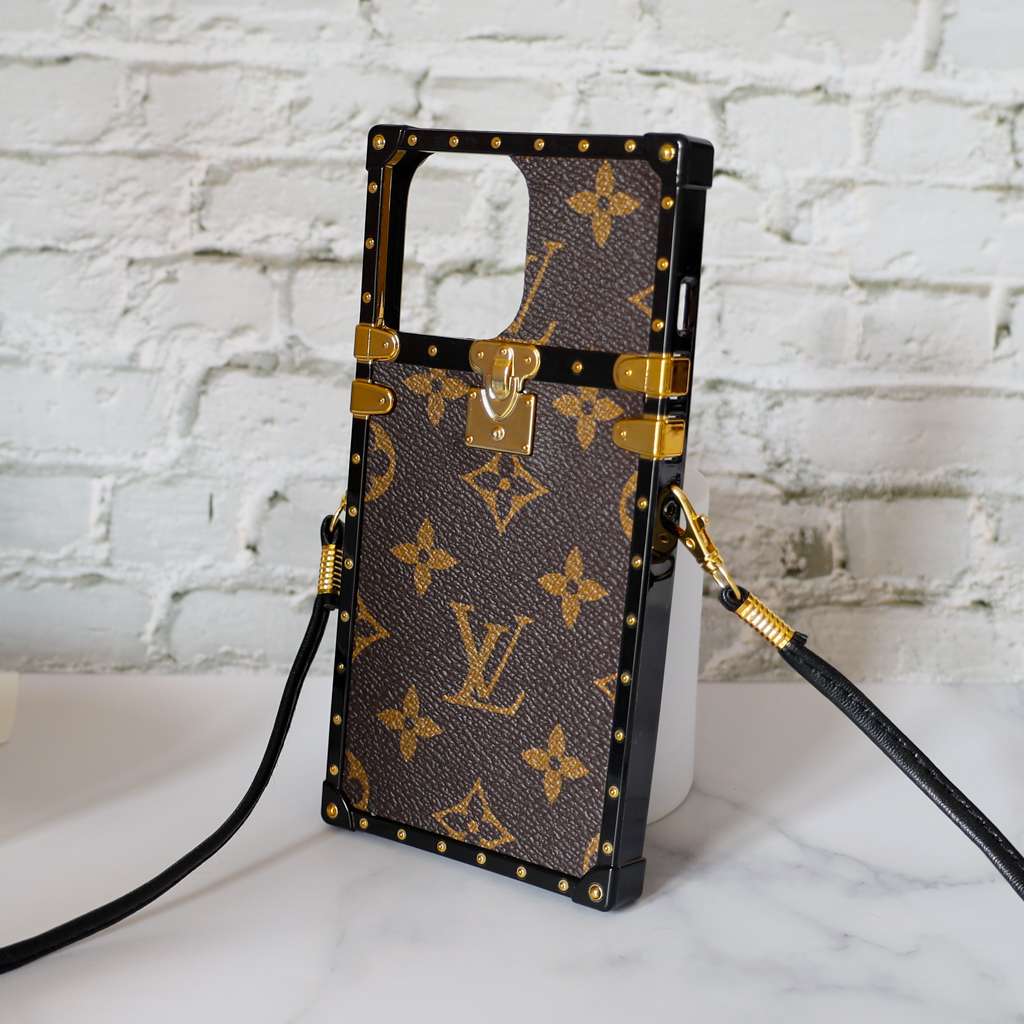Reverse monogram Eye Trunk iPhone case right side view showing the protective side structure