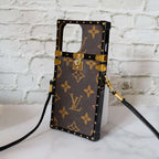 Reverse monogram Eye Trunk iPhone case right side view showing the protective side structure