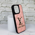 Close-up of the pink stamped leather iPhone case highlighting texture and pattern