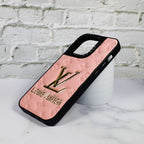 Detailed view of the pink stamped leather iPhone case and its smooth protective finish