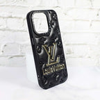Close-up of the black stamped leather iPhone case highlighting texture and camera area