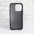 Black LV stamped leather iPhone case showing the fitted edges and dark protective finish