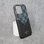 Close-up of the black checkered iPhone case showing the leather texture and pattern