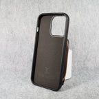 Designer iPhone wallet case showing the zipped card holder and protective phone shell