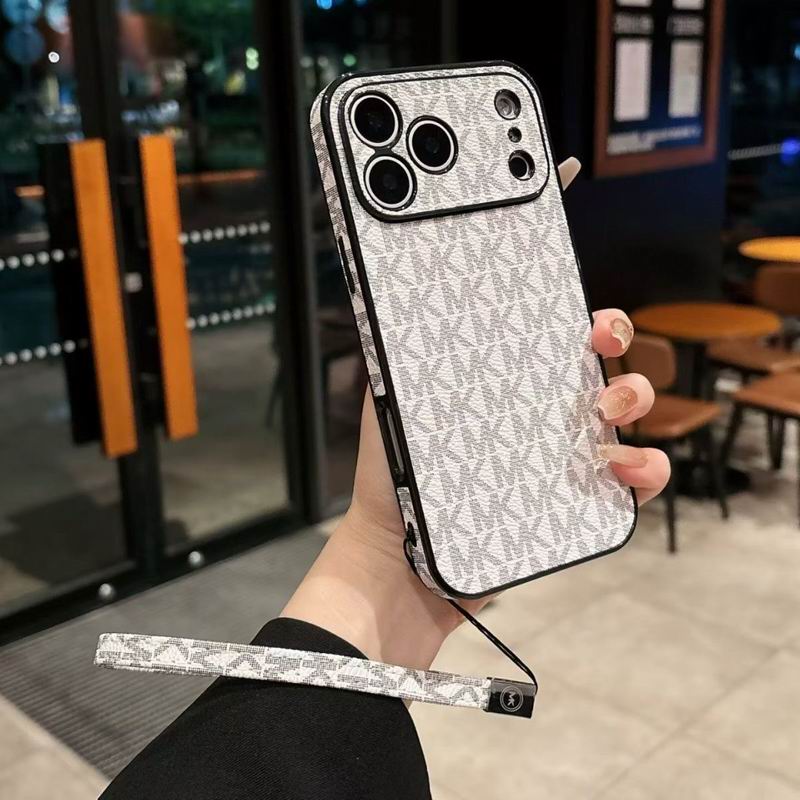 Close-up of the MK hand strap iPhone case showing leather texture and strap attachment