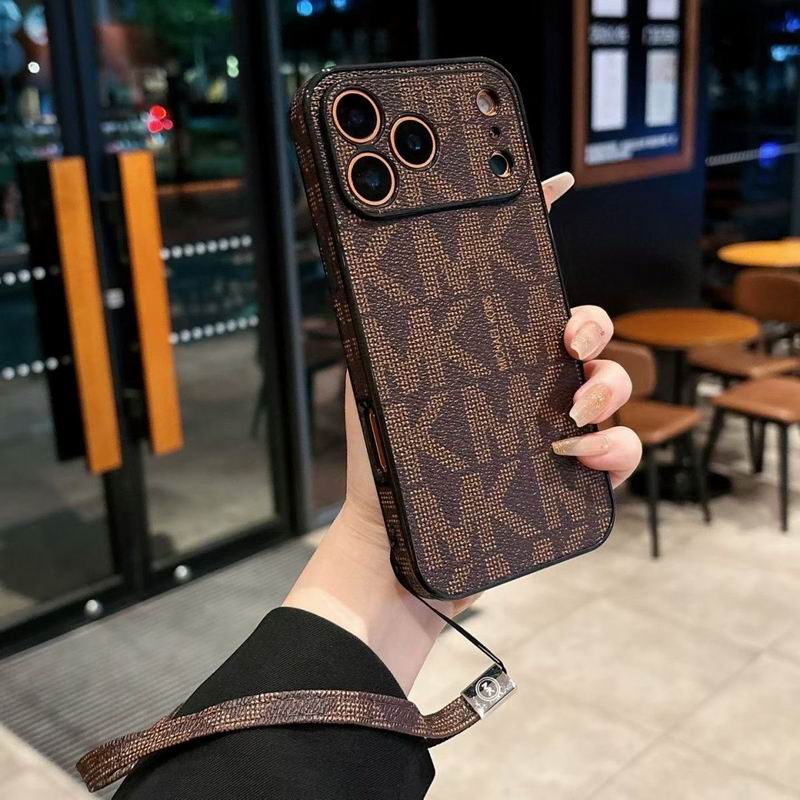 Detailed view of the MK iPhone case highlighting the hand strap and protective corners