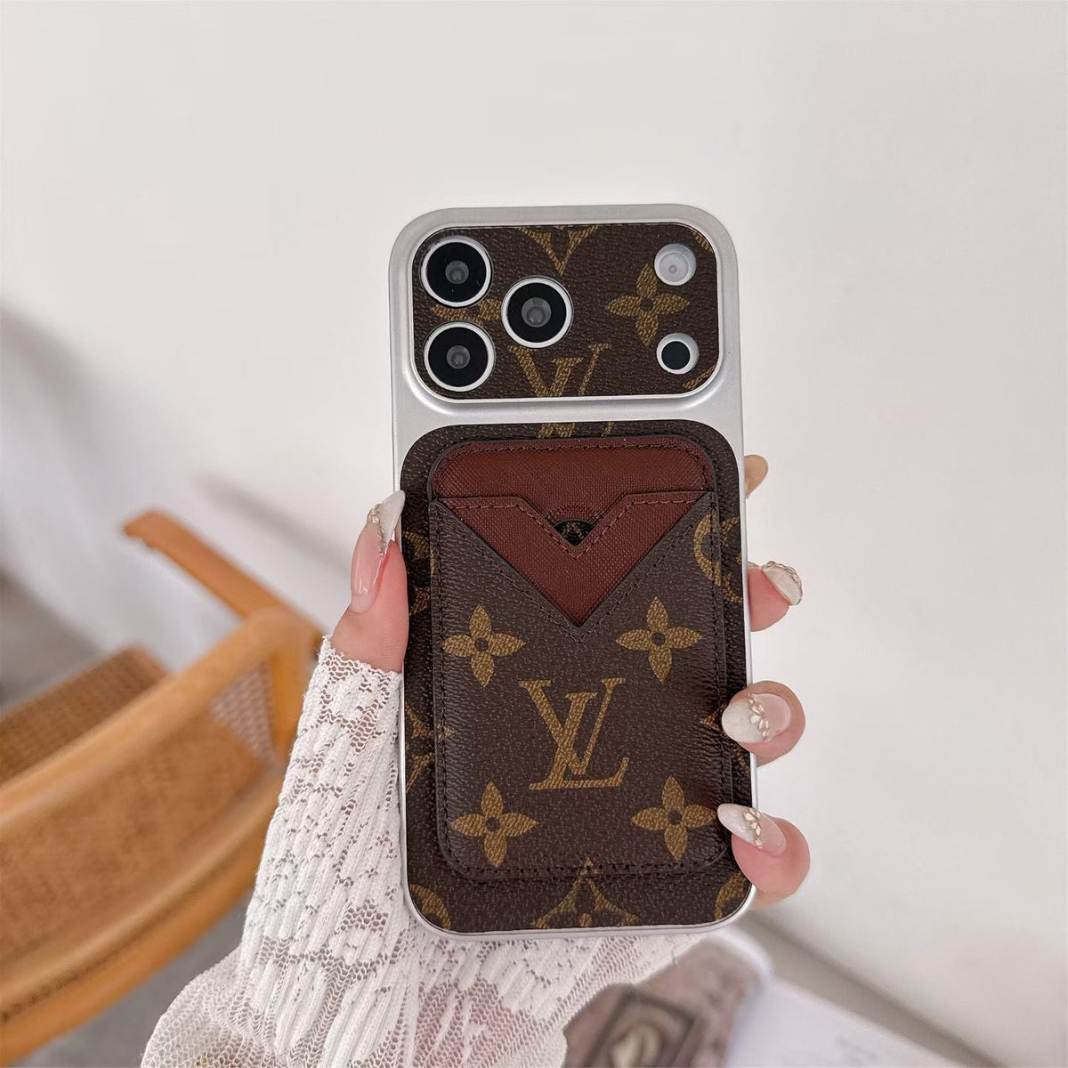Magnetic card holder LV iPhone case showing the protective rear design and magnetic attachment