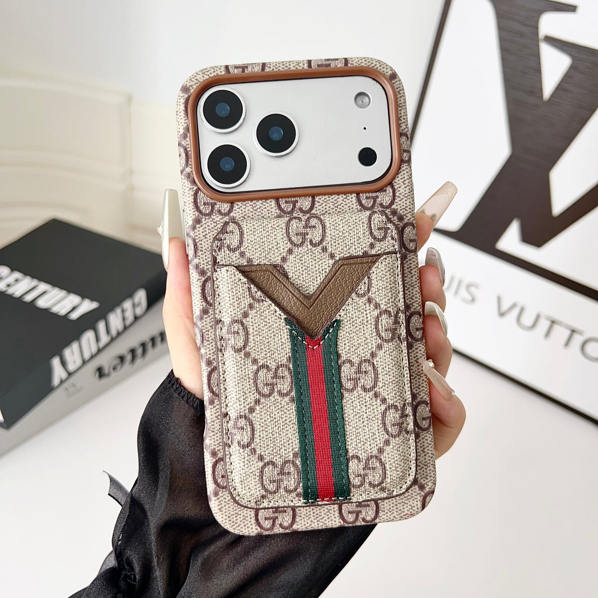 LV iPhone magnetic wallet case showing the patterned surface and integrated card holder