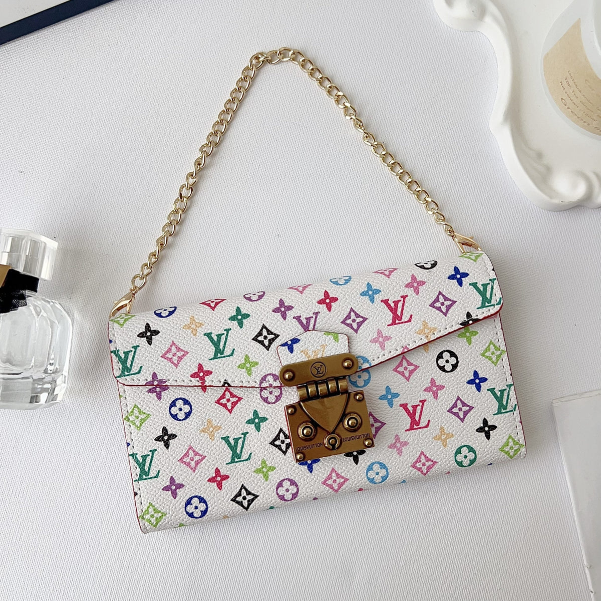 LV style crossbody iPhone case showing the strap attachment and protective rear cover