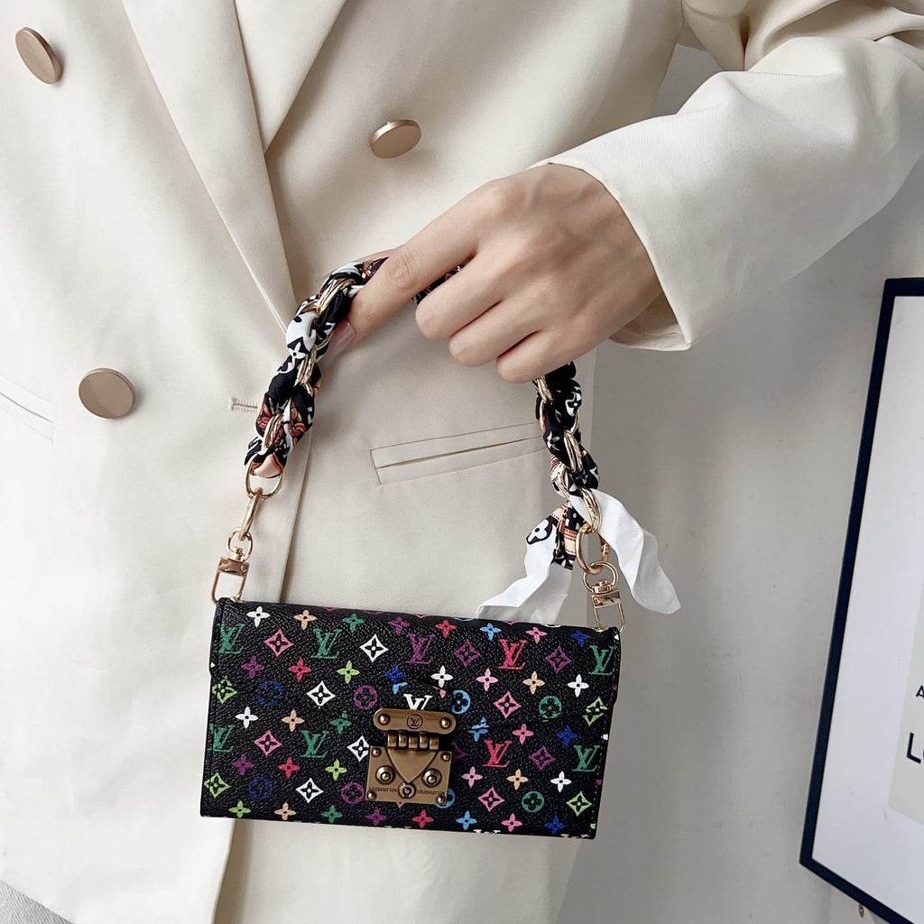 Multicolor LV style iPhone case showing the crossbody strap and protective camera area