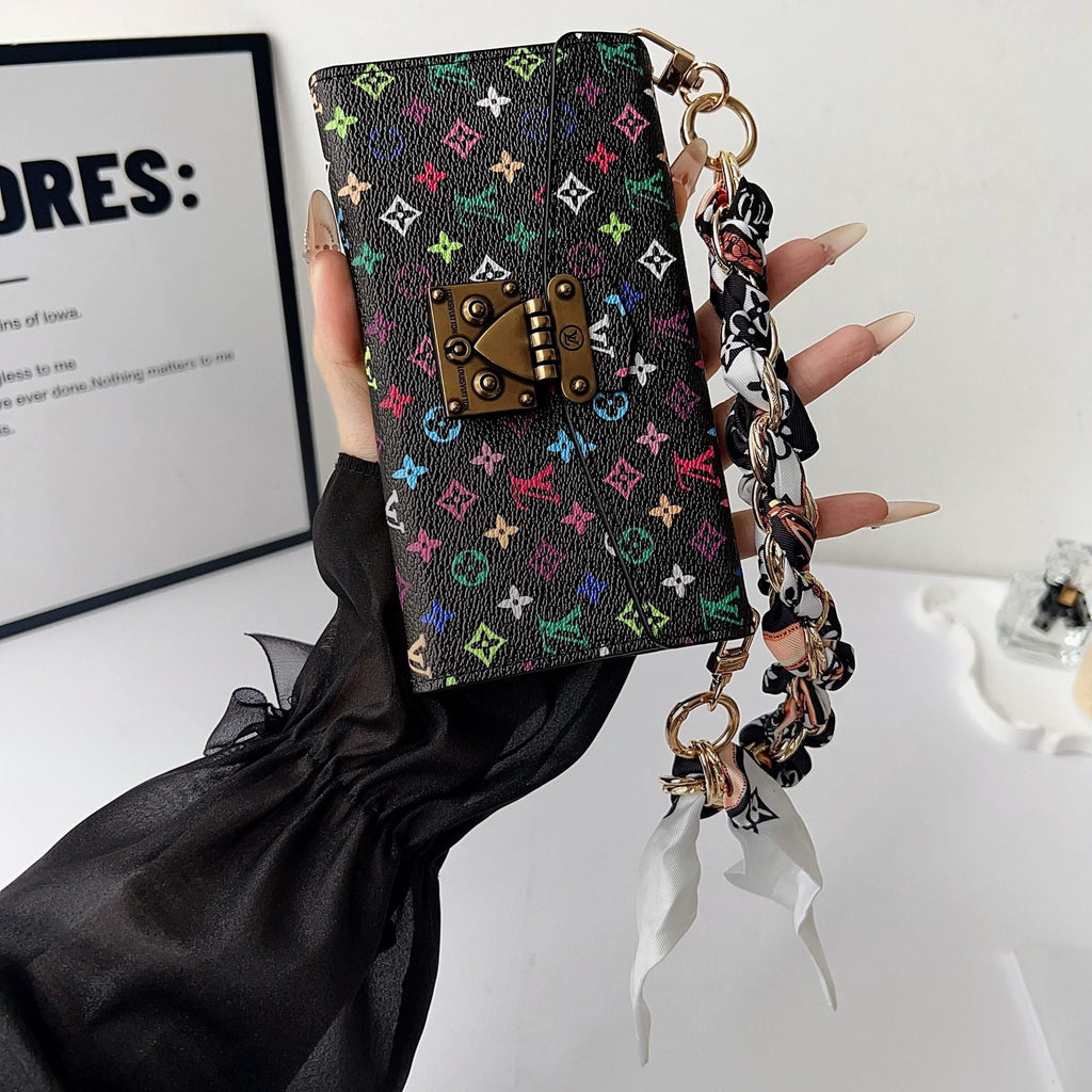 Multicolor crossbody iPhone wallet case shown with the shoulder strap for hands-free carry