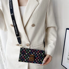 Multicolor LV style crossbody iPhone wallet case showing the strap and patterned back