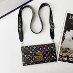 Detailed view of the LV style crossbody case showing the strap, edges and rear pattern