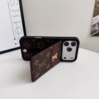 Louis V vertical folding card holder iPhone case showing the folding cover and camera area