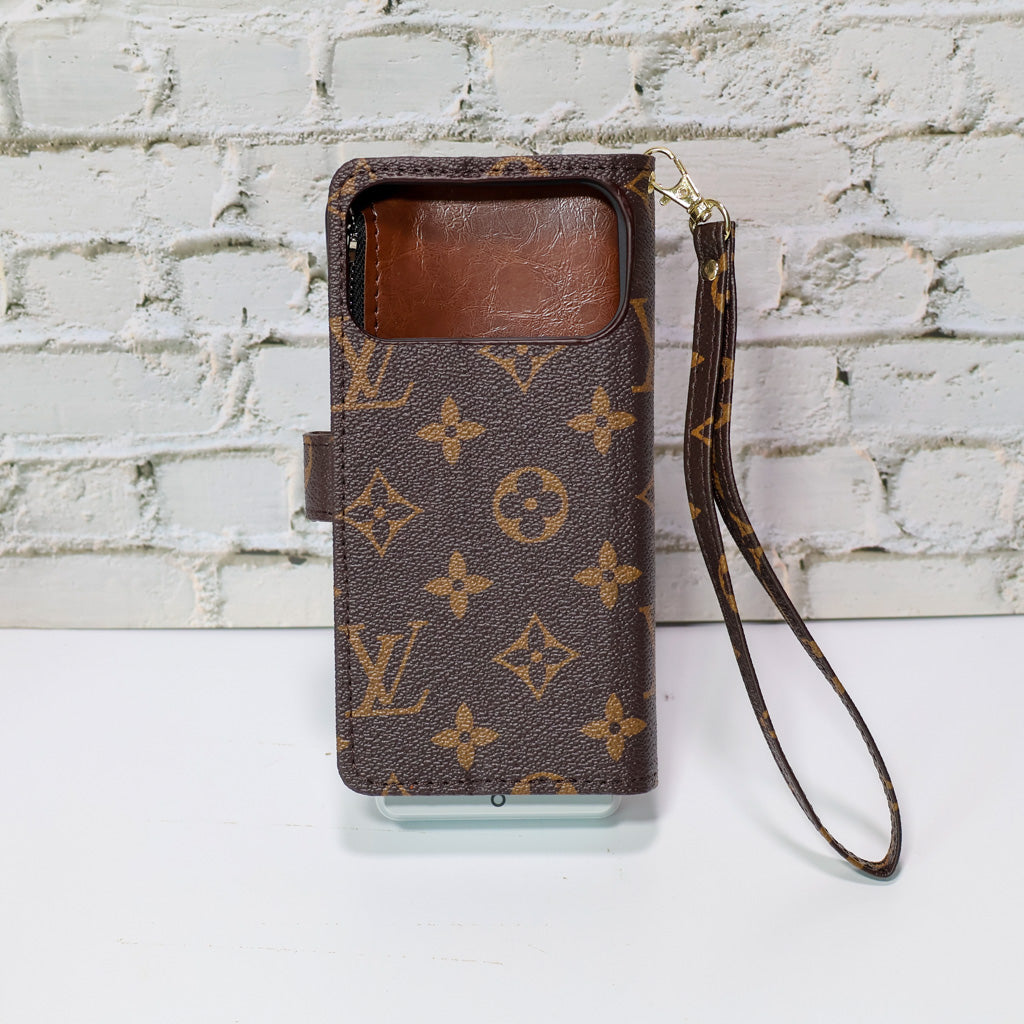 Zippered LV wallet iPhone case showing the slim folio profile and card storage