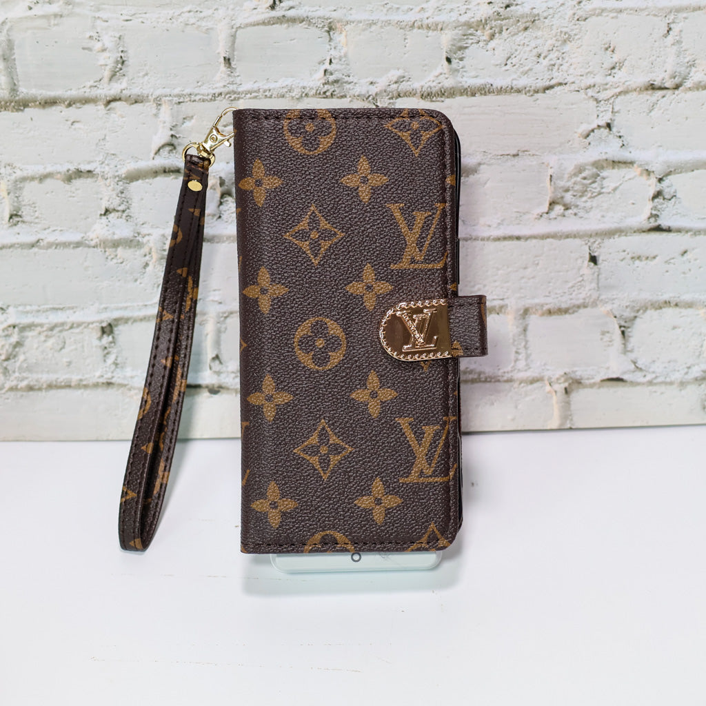 Zippered LV wallet iPhone case showing the fitted protective shell and folding storage cover