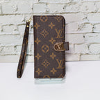 Zippered LV wallet iPhone case showing the fitted protective shell and folding storage cover