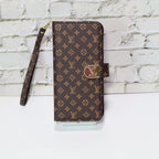Zippered LV wallet iPhone case close-up showing the wallet compartments and leather texture