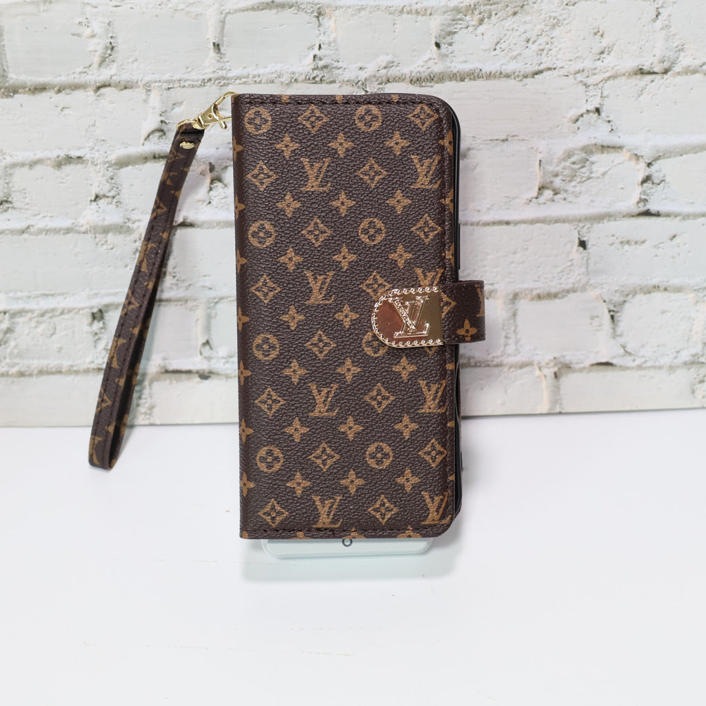 Zippered LV wallet iPhone case close-up showing the wallet compartments and leather texture