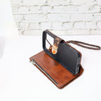 Zippered LV wallet iPhone case shown open with storage compartments and folding cover