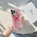 Pink butterfly-print iPhone case with a beaded wrist strap