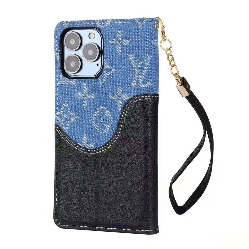 Blue denim leather iPhone wallet case showing the folding cover and textured rear design