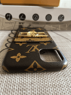 Monogram leather iPhone case showing the complete protective cover and patterned surface