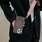 LV design crossbody iPhone case close-up showing the strap hardware and protective back